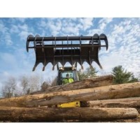 Backhoe Loader Grapples Scrap